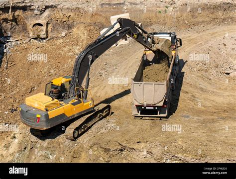 Image result for Large Excavators Loading Trucks