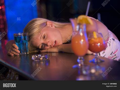 Drunk Young Woman Passed Out Bar Image & Photo | Bigstock