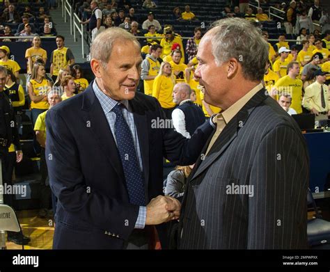 Michigan head coach John Beilein, left, shakes hands with Southern ...