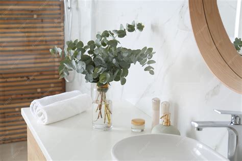 Premium Photo | Fresh eucalyptus branches on countertop in bathroom