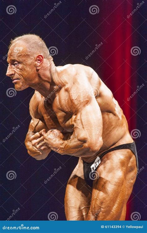 Bodybuilder Shows Most Muscular Pose on Stage in Championship Editorial ...