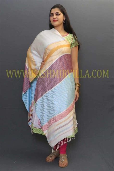 Textured print on white colour base along with zig zag pattern looks
