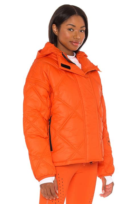 adidas by Stella McCartney Short Puffer in App Signal Orange | REVOLVE