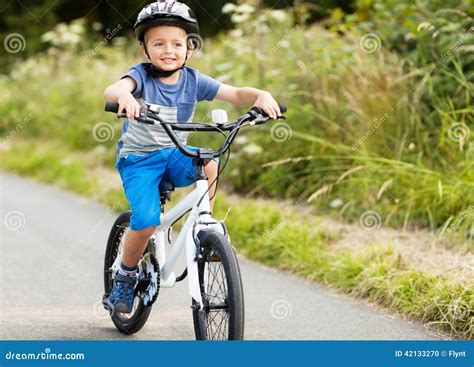 Boy Learning To Ride His Bike Stock Photo - Image of leisure, ecstatic ...