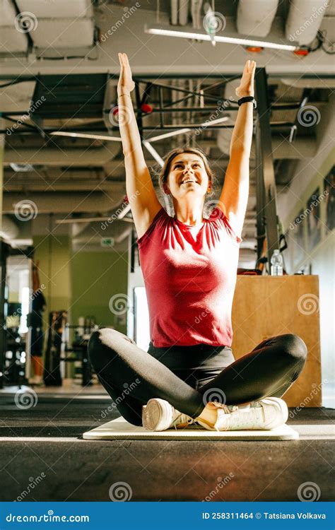 Plus Size Girl Sit on Mat in Fitness Gym with Crossed Legs and Raised ...