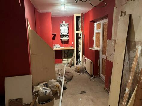 Boarded-up house with holes in the floorboard could be yours for £ ...