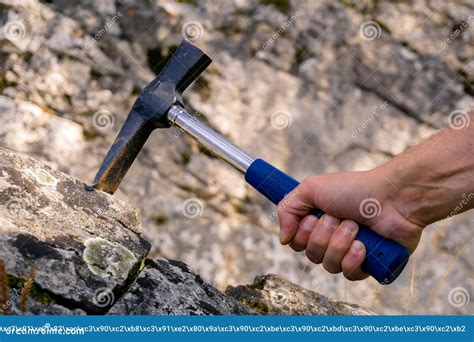 Geological hammer in hand stock photo. Image of activity - 132364644