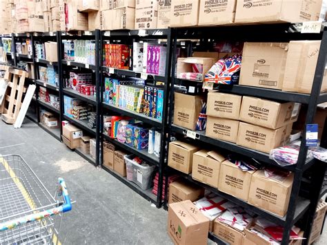 38x Black Costco Shelving Units and 8x Costco Packing Benches