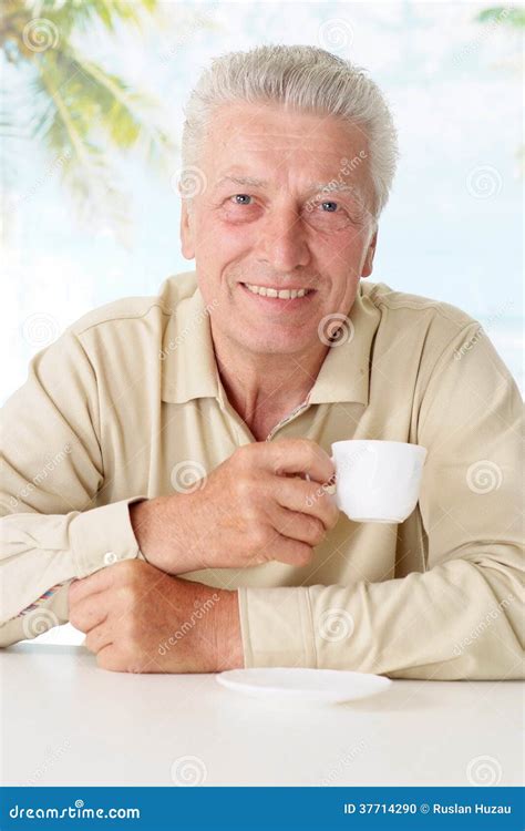 Old Man Drinking Coffee at Table Stock Photo - Image of senior ...