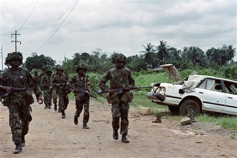 Liberian Civil War A Rebel Fighter In Monrovia Wearing A Dress Armed