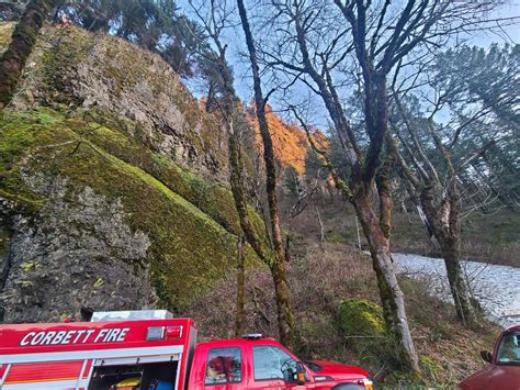 Two stranded hikers make their way out of Multnomah Falls