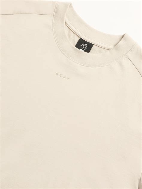 Shop Men Cream Solid Relaxed Fit Round Neck T-shirt Online ...