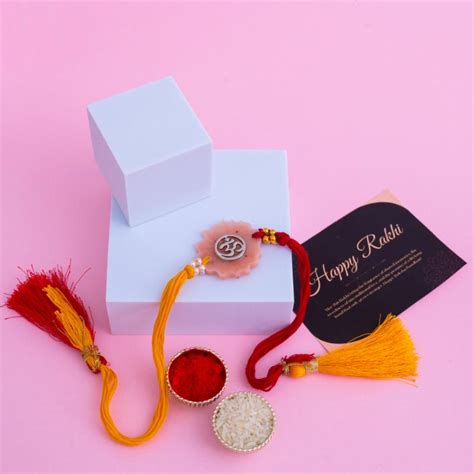 Send Serene Om Resin Rakhi & Soan Papdi Delight Online