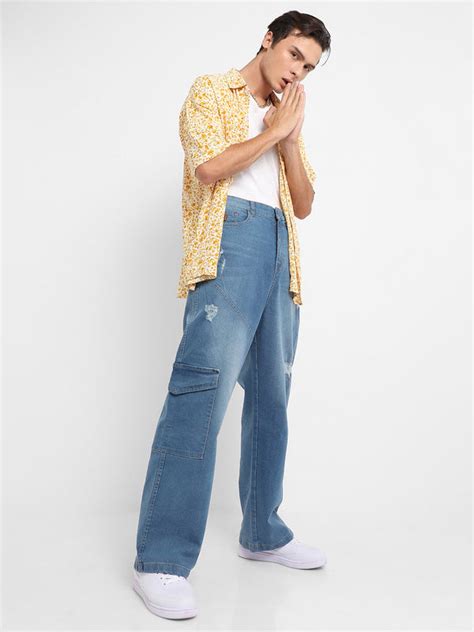 ₹1,199 | Campus Sutra Men's Light Blue Asymmetrical Stitch Denim Jeans ...