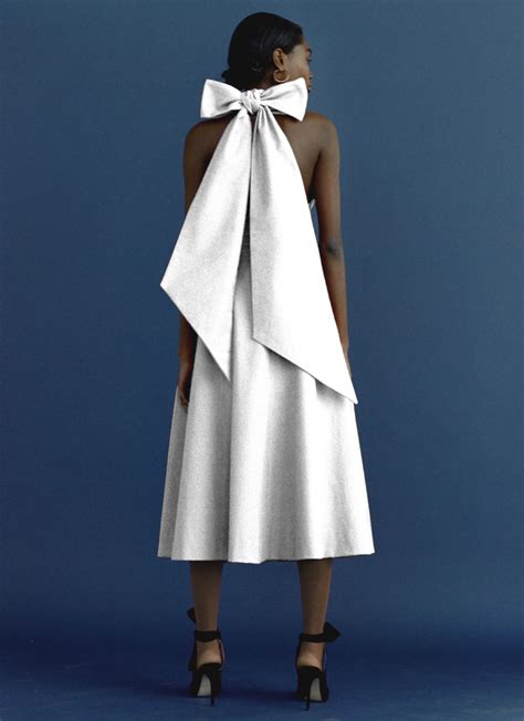 White cotton tea length wedding dress with bow tie halter neck and ...