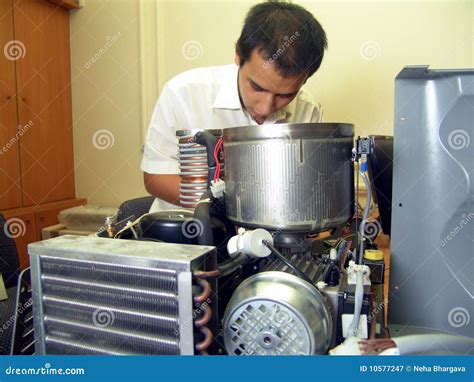 Image result for An Engineer Fixing Machine