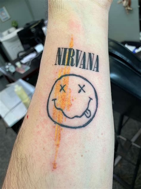 Nirvana Smiley Face Logo Tattoo