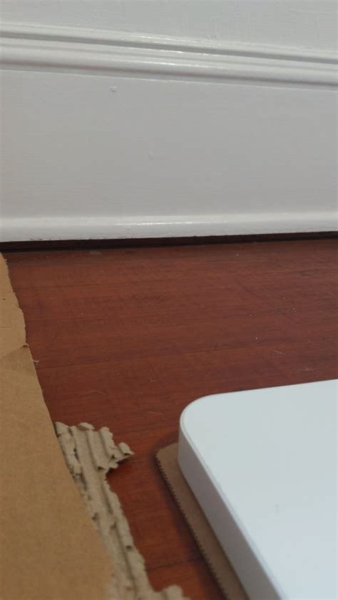 what's the easiest way to cover this large gap between baseboards and ...