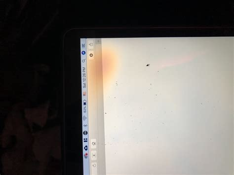Orange smudge/splotch near edge of screen on MacBook Pro - Ask Different