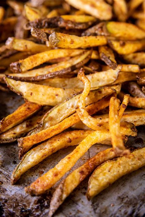 Garlic Parmesan French Fries Dressed in Caesar Dressing. - Half Baked ...