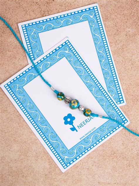 Blue Pottery 3 Bead Rakhi Turquoise Color – NEERJA INTERNATIONAL INC