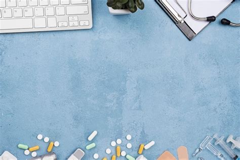 Medical desk arrangement on blue cement background | Free Photo