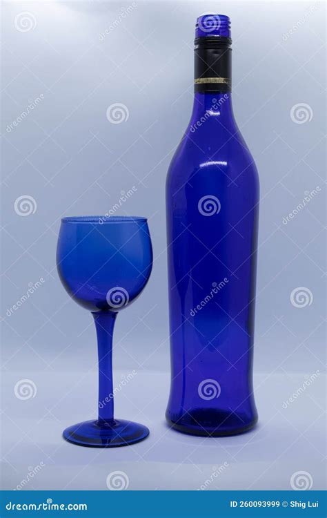 Blue Glass Wine Glass and Blue Wine Bottle 4 Stock Image - Image of ...