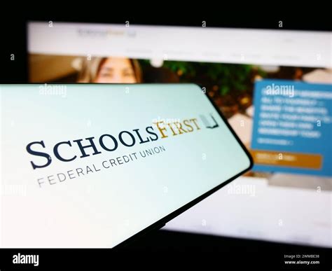 Mobile phone with logo of American financial company SchoolsFirst ...
