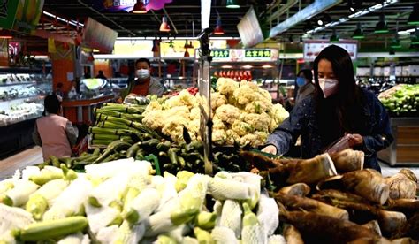 Citizens shop at a supermarket in Xining City