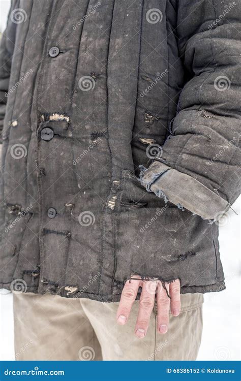 Man Dressed in Shabby Old Worn Working Clothes with Holes Stock Photo ...