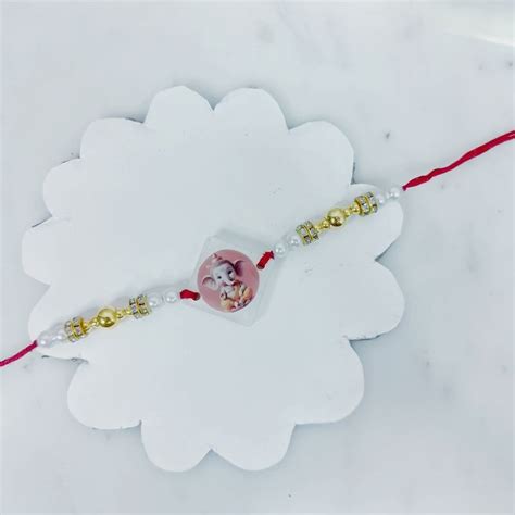 Send Glowing Ganesha Blessing Rakhi Online