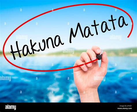 Man Hand writing Hakuna Matata (Swahili phrase; it means "no worries ...