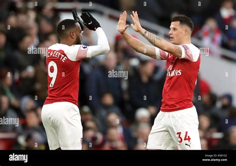 Arsenal's Granit Xhaka (right) celebrates scoring his side's first goal ...