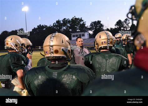Fort Knox Eagles head coach Wes Arnold encourages his football players ...