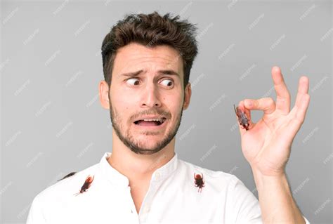 Premium Photo | Young handsome man isolated with cockroachs