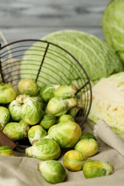 Still life with assortment cabbages on wooden background | Premium Photo