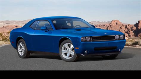 Download Powerful Blue Dodge Challenger in a Dynamic Pose Wallpaper | Wallpapers.com