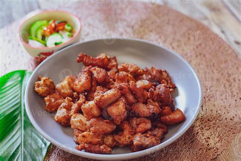 Fried Pork Belly with Fish Sauce and Sticky Rice Served on a white ...