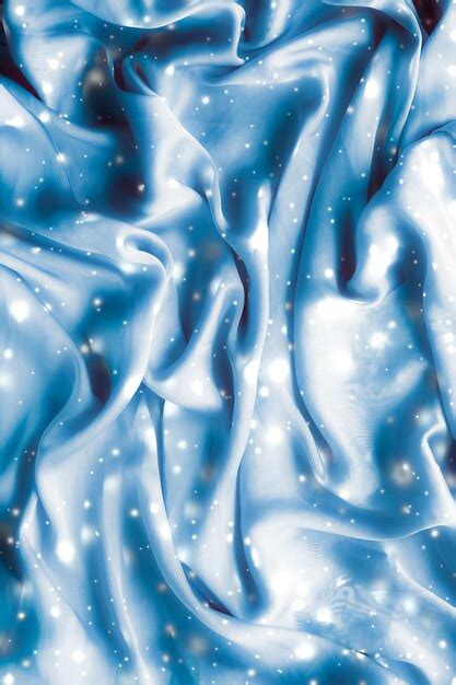 Magic holiday blue soft silk flatlay background texture with glowing ...