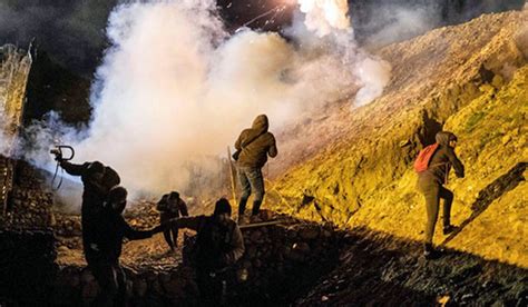 Tear gas fired as dozens of migrants try illegal crossing to US- The Week