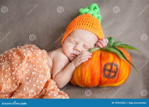 Newborn Baby Wearing a Knitted Carrot or Pumpkin Hat Stock Image ...