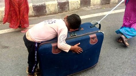 Pic Of Migrant Child Sleeping On Suitcase Goes Viral