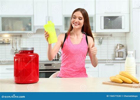 Young Woman with Bottle of Protein Shake in Stock Photo - Image of athlete, energetic: 156577530