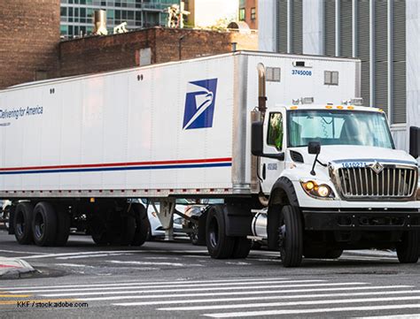 U.S. Postal Service (USPS) trucks are parked at a post office on August 23, 2024 in Glendale, Califo