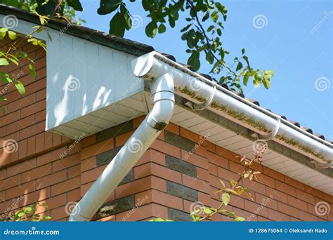 White Plastic Rain Gutter. House Roof Guttering Repair Stock Photo ...