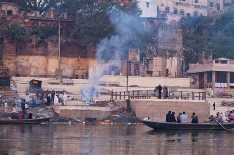 Premium Photo | Holy city for hindu religion varanasi, old buildings, boats and cremation scenes ...
