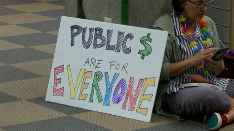 LGBTQ+ community holds ‘read-in’ at Blasco Library over pride display ...