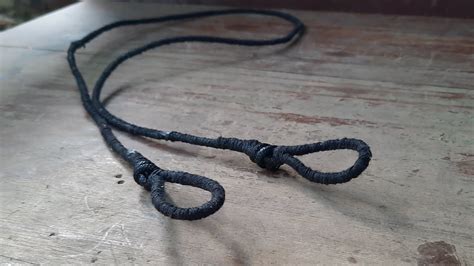 Cómo examinar la cuerda de tu arco