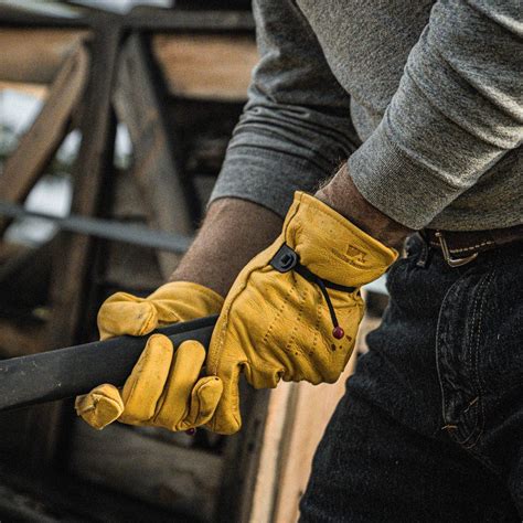 Wells Lamont leather work gloves for carpenters with durable material and reinforced palm