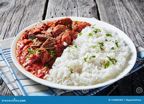 Beef Stew with Rice on a White Plate Stock Image - Image of meal ...